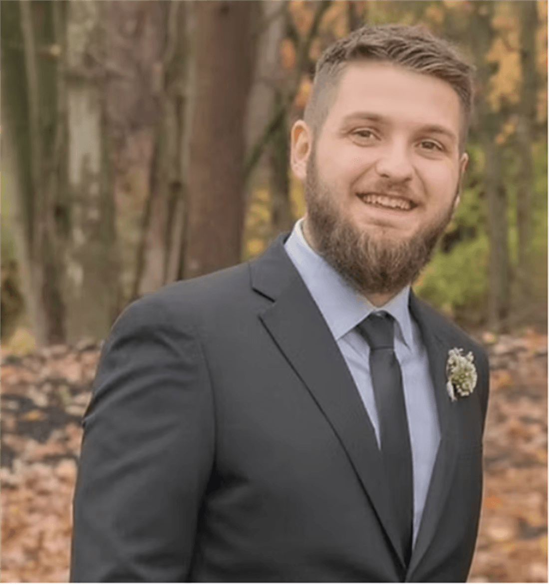 Dr. Luke Johnston in a black suit
